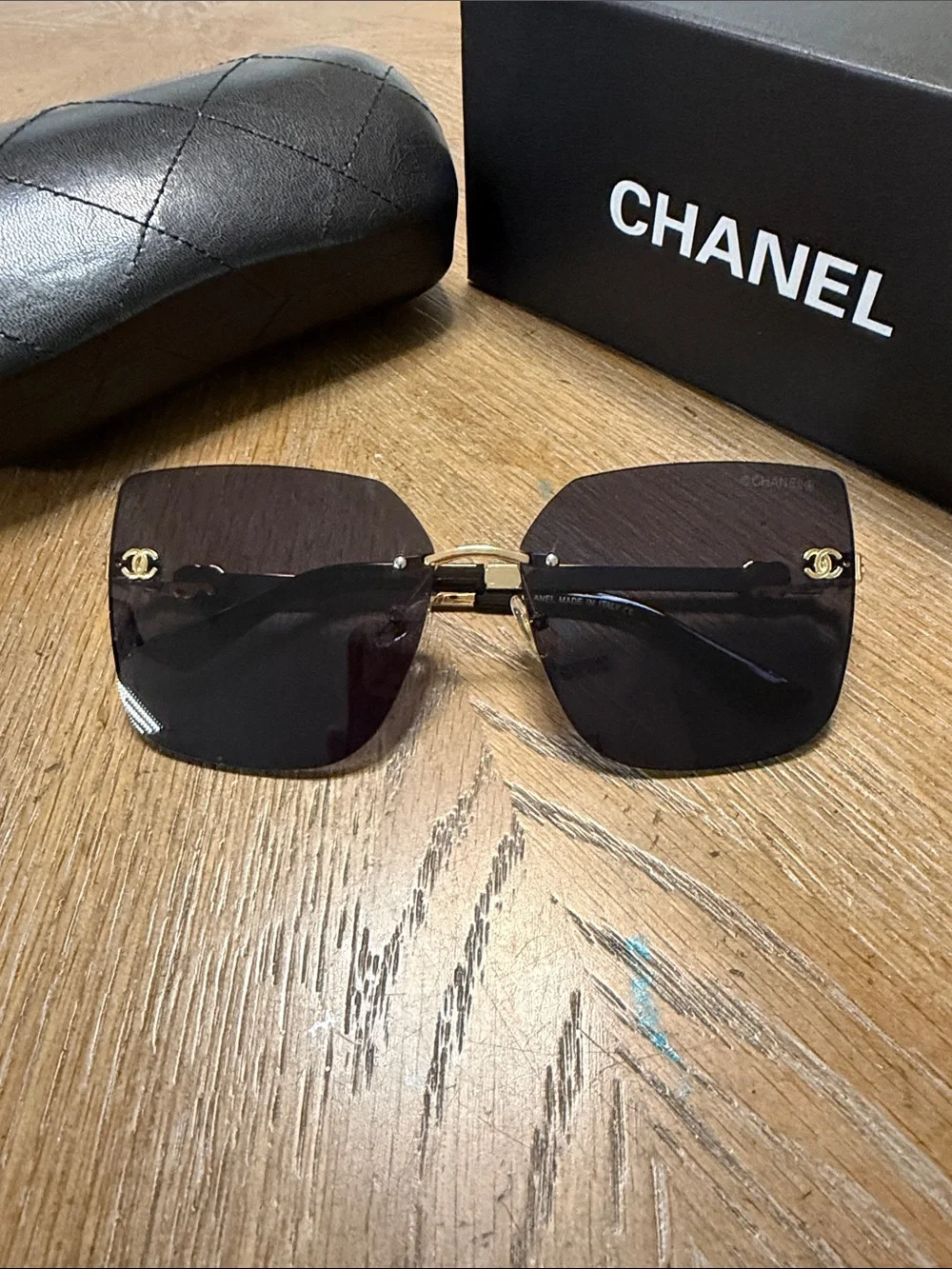 CHANEL Rimless Square Sunglasses in Dark Gradient with Gold Accents